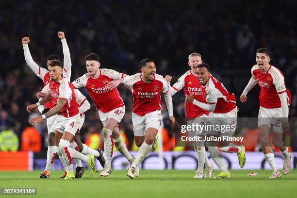 The players of Arsenal celebrate as David Raya of Arsenal makes the match-winning save from the fourth penalty from Galeno of FC Porto in the penalty...