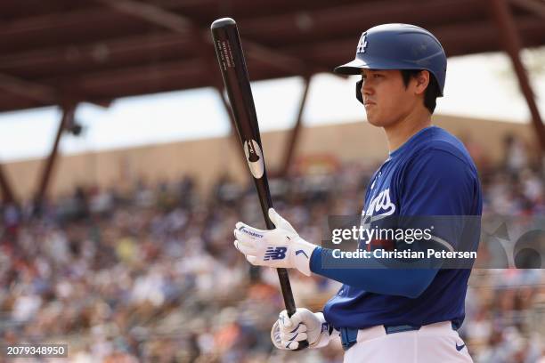 Shohei Ohtani of the Los Angeles Dodgers bats against the San Francisco Giants during the fifth inning of the MLB spring game at Camelback Ranch on...