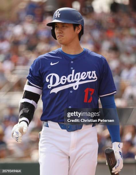 Shohei Ohtani of the Los Angeles Dodgers bats against the San Francisco Giants during the fifth inning of the MLB spring game at Camelback Ranch on...