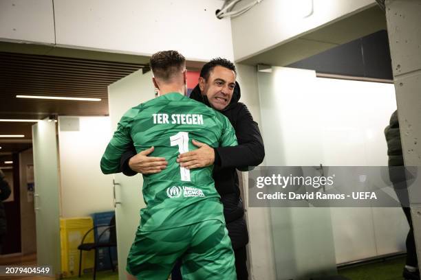 Head Coach Xavi Hernandez of FC Barcelona celebrates with Marc-André ter Stegen of FC Barcelona outside the dressing room after their victory during...