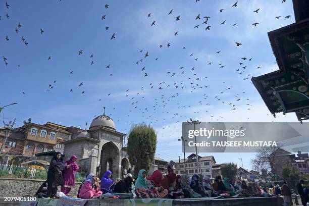 Muslim devotees offer first Friday prayers of the Islamic holy month of Ramadan at the Shah-i-Hamdan shrine in downtown Srinagar on March 15, 2024.