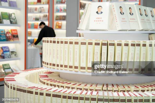 Copies of Chinese General Secretary Xi Jinping's 'The Governance of China' are displayed in the Simplified Chinese alphabet at the London Book Fair...