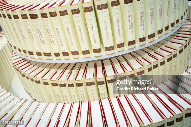 Copies of Chinese General Secretary Xi Jinping's 'The Governance of China' are displayed in the Simplified Chinese alphabet at the London Book Fair...