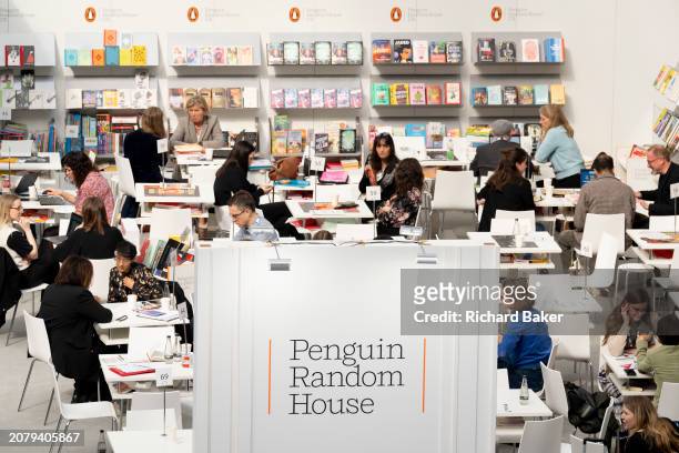 Meetings and book deals on the Penguin Random House book trade stand during the third and final day of the London Book Fair at the Olympia Exhibition...