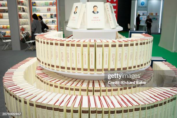 Copies of Chinese General Secretary Xi Jinping's 'The Governance of China' are displayed in the Simplified Chinese alphabet at the London Book Fair...