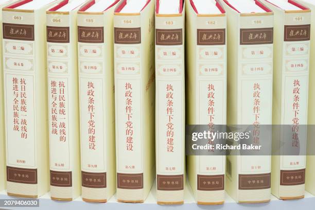 Copies of Chinese General Secretary Xi Jinping's 'The Governance of China' are displayed in the Simplified Chinese alphabet at the London Book Fair...