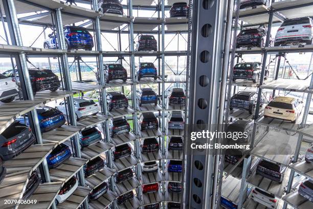 Automobiles inside of the Autostadt delivery tower at the Volkswagen AG headquarters and auto plant complex in Wolfsburg, Germany, on Thursday, March...