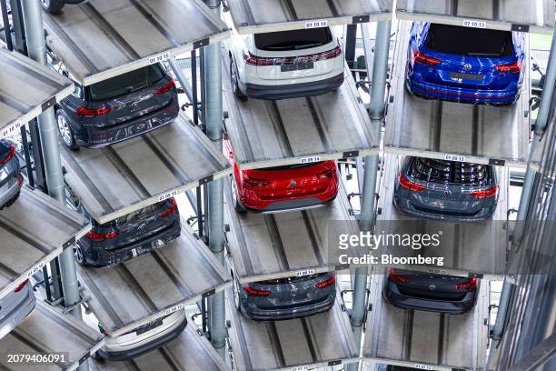 Automobiles inside of the Autostadt delivery tower at the Volkswagen AG headquarters and auto plant complex in Wolfsburg, Germany, on Thursday, March...