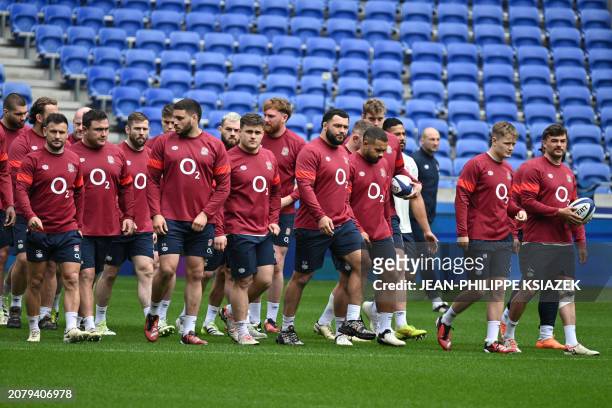 England's players take part in a training session at the Groupama Stadium in Decines-Charpieu, east of Lyon, on March 15 on the eve of the Six...