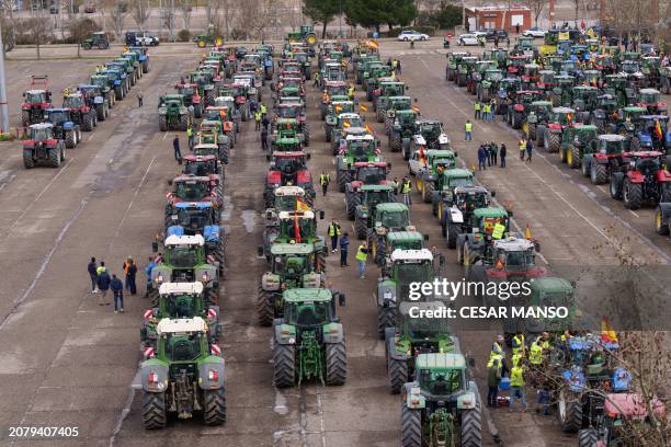 Spanish farmers gather with their tractors during a protest in demand of fair conditions for the agricultural sector, in Valladolid, northern Spain,...