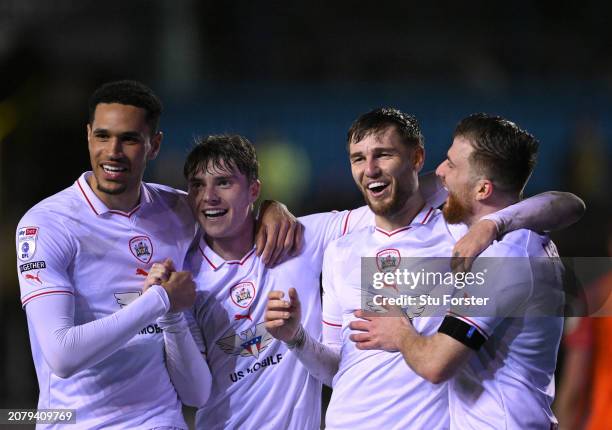 Barnsley player John McAtee celebrates the second goal with team mates during the Sky Bet League One match between Carlisle United and Barnsley at...