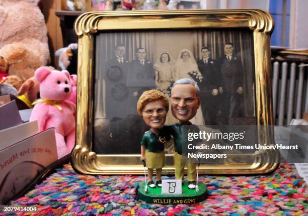 Bobble head in front of a wedding photograph of Gino Turchi and his wife, Willie, who have been married for 72 years in Clifton Park, NY Wednesday,...
