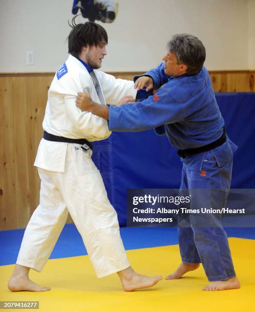 Olympic bound Judo competitor Kyle Vashkulat, left, works with coach Jason Morris, a silver medalist in Judo at the 1992 summer Olympics,at the Jason...