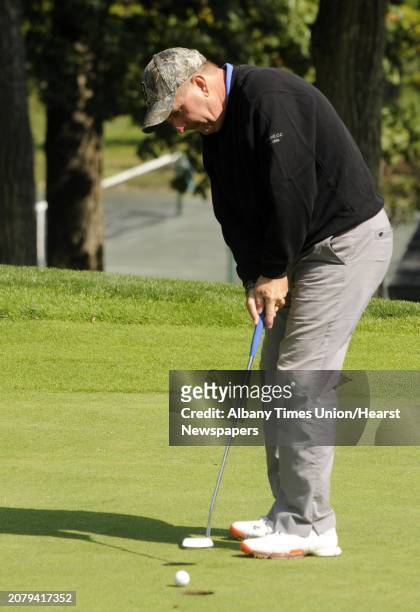 Bob Mucha sinks a putt on the ninth hole during the final of the Northeastern New York PGA Match Play Championship at the Albany Country Club in...