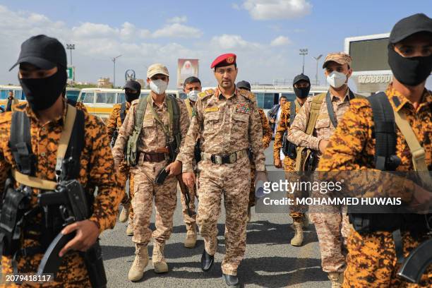 Huthi military spokesman Brigadier Yahya Saree arrives to deliver a statement during a rally in Sanaa in solidarity with Palestinians on March 15,...
