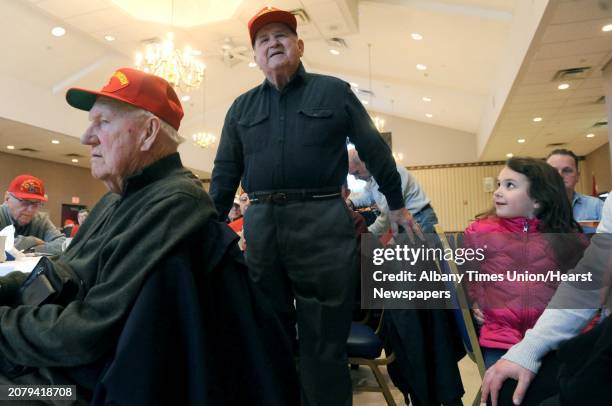 Battle of Iwo Jima veteran Sal Famularo, center, of Glenville speaks as he is recognized during a ceremony to remember those who fought and died in...