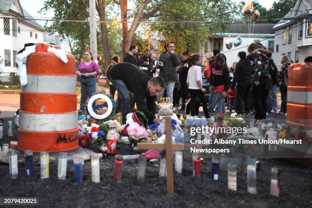 Family, friends and neighbors attend a vigil for Donavan Duell, the youngest victim of Schenectady fatal fire, on what would have his first birthday...