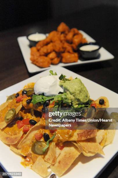 The mountain of nachos and boneless Buffalo wings at Dave & Buster's at Crossgates on Saturday Jan. 25, 2014 in Guilderland, N.Y.