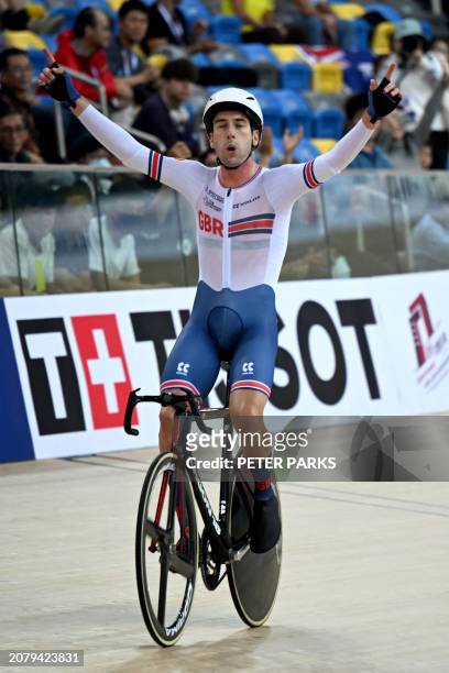 William Perrett of Britain celebrates after his win at the men's elimination race event during the Track Cycling Nations Cup in Hong Kong on March...
