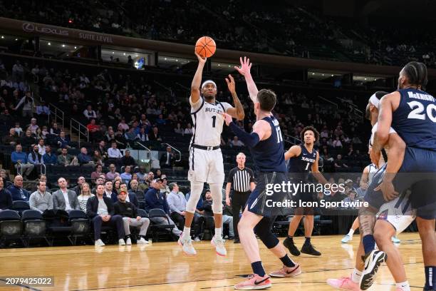 Butler Bulldogs center Jalen Thomas shoots over Xavier Musketeers forward Lazar Djokovic during the Big East Tournament men's college basketball game...