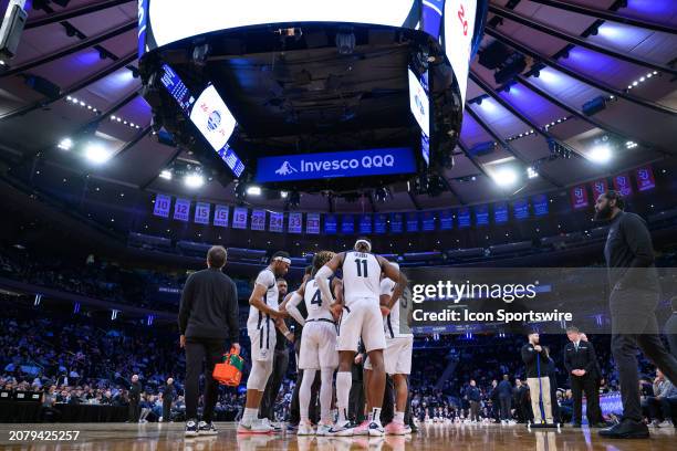 The Butler Bulldogs huddle on the court during the Big East Tournament men's college basketball game between the Butler Bulldogs and Xavier...