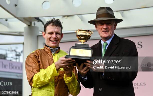 Gloucestershire , United Kingdom - 15 March 2024; Jockey Paul Townend and trainer Willie Mullins celebrate with the Gold Cup after winning the...