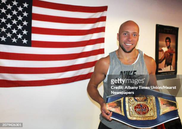 Professional boxer Shawn Miller with his WBF light heavy weight North American championship belt at Millhouse Boxing on Wednesday Aug.13, 2014 in...