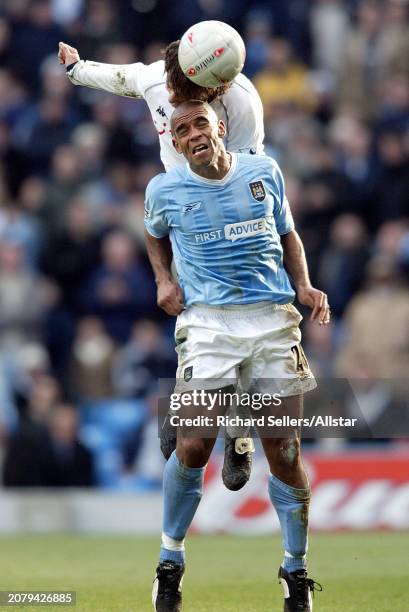 Mauricio Taricco of Tottenham Hotspur and Trevor Sinclair of Manchester City challenge during the Fa Cup 4th Round match between Manchester City and...