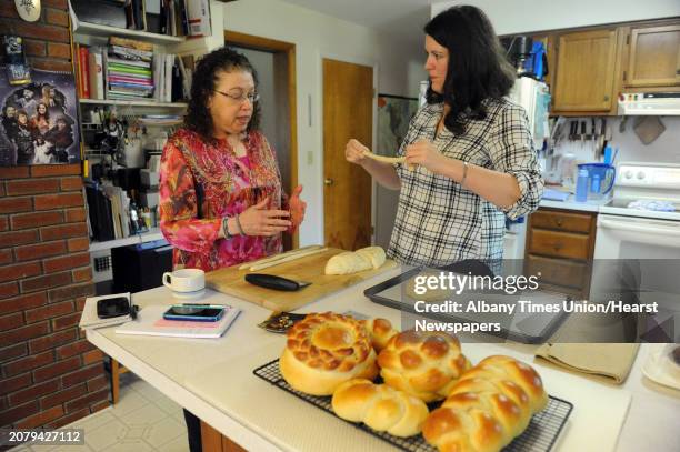 Cecile Kowalski, left, shows Deanna Fox, right, how to make challah bread Friday Sept. 26 at Kowalski's home in Selkirk, N.Y.