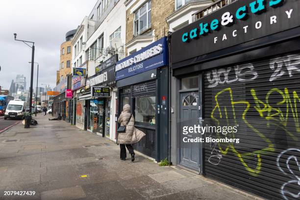 Shop fronts in the Tower Hamlets borough of London, UK, on Friday, March 15, 2024. UK headline inflation data due out Wednesday will likely drop back...