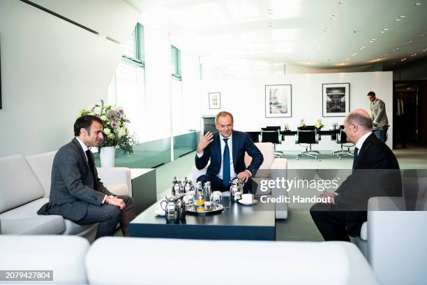 In this handout image provided by German Government Press Office , German Chancellor Olaf Scholz , Poland's Prime Minister Donald Tusk , and France's...