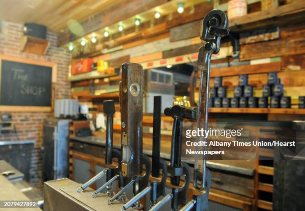 Vintage tools used as draft pulls at Kevin Blodgett's new bar called The Shop on Friday Oct. 10, 2014 in Troy, N.Y. A 35,000-square-foot Troy...