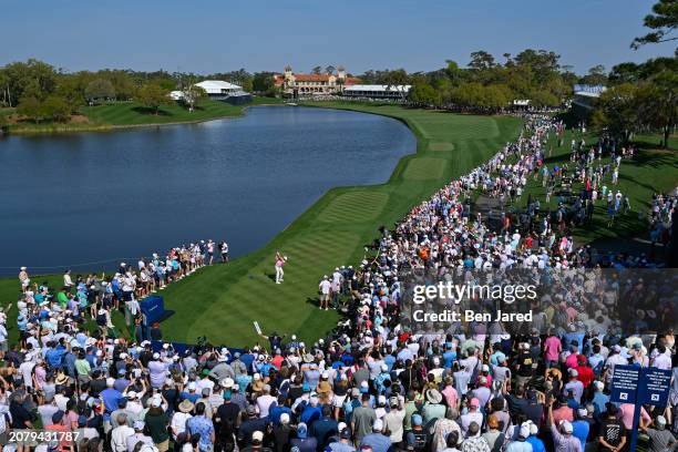 Scottie Scheffler hits a tee shot on the 18th hole during the second round of THE PLAYERS Championship at Stadium Course at TPC Sawgrass on March 15,...