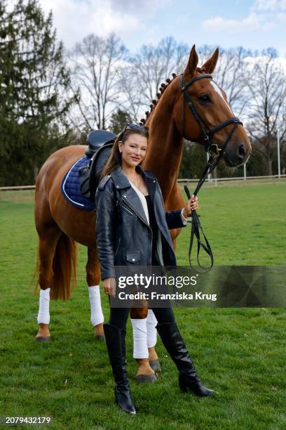 Joelina Drews, new ambassador of Pferd International Muenchen , poses during a photo shoot at Olympia Reitanlage on March 15, 2024 in Munich-Riem,...
