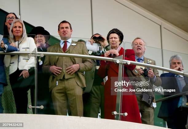 The Princess Royal and Peter Phillips watch the action from the BetMGM County Handicap Hurdle on day four of the 2024 Cheltenham Festival at...