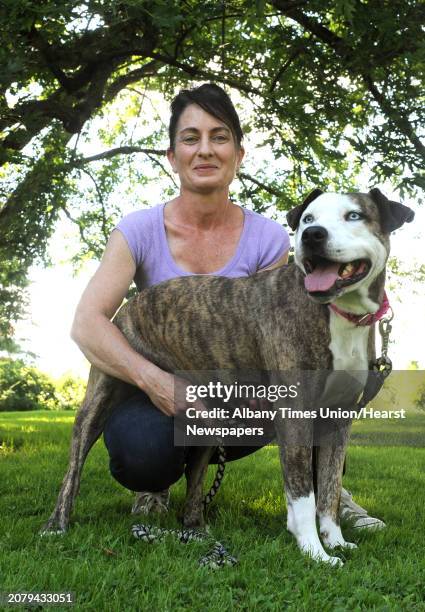 Staci Lawrence and her therapy dog Fiona on Tuesday Aug. 4, 2015 in Selkirk, N.Y.