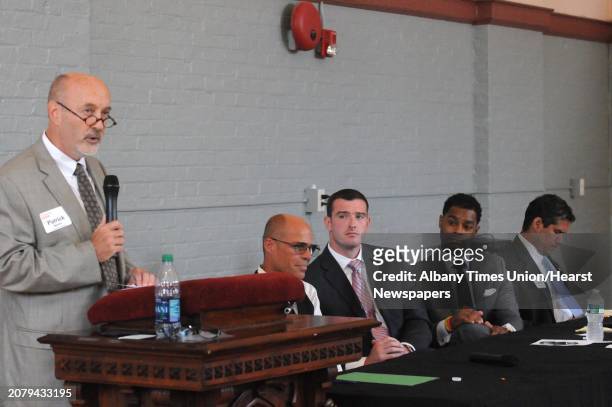 Cadidate Patrick Madden, left, speaks during a mayoral brown bag discussion with all five mayoral candidates Democrats: Ernest Everett, Rodney...