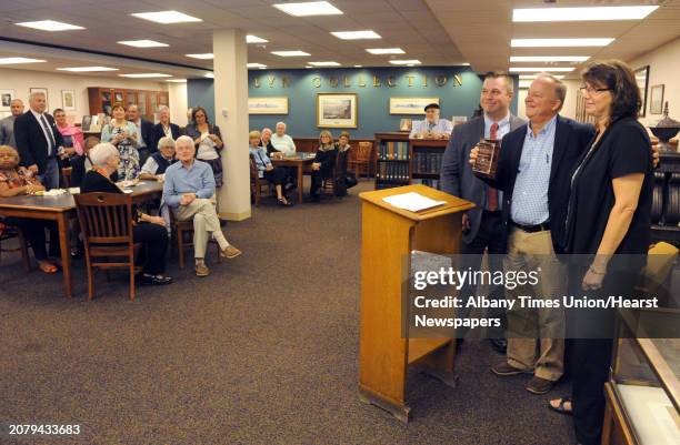 The Albany Public Library honored Author Paul Grondahl, center, for his donation of documents to the local history collection APL Executive Director...