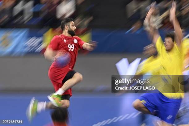 Bahrain's centre back Husain Alsayyad jumps to shoot during the qualifying handball match for the 2024 Paris Olympic Games between Bahrain and Brazil...