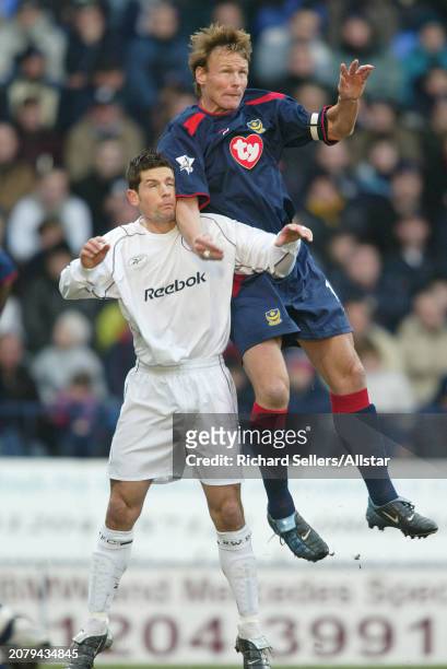 January 17: Teddy Sheringham of Portsmouth and Anthony Barness of Bolton Wanderers challenge during the Premier League match between Bolton Wanderers...