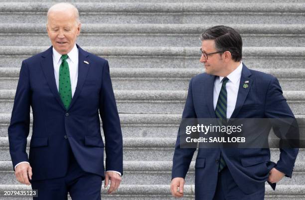 President Joe Biden and Speaker of the House Mike Johnson depart after the annual Friends of Ireland luncheon, at the US Capitol in Washington, DC,...