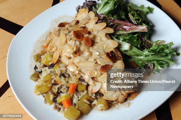 Trout almondine, fresh Idaho brook trout, filleted, pan seared with slivered almonds, wild rice pilaf, roasted seasonal root vegetables at Lark &...