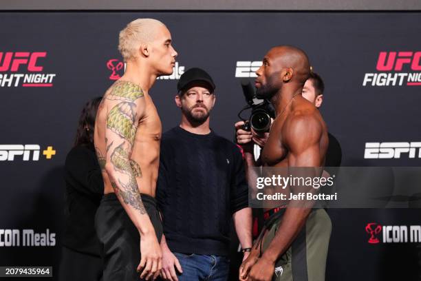 Bryan Battle and Ange Loosa of the Congo face off during the UFC Fight Night weigh-in at UFC APEX on March 15, 2024 in Las Vegas, Nevada.