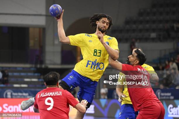 Brazil's left wing Hugo Bryan Monte da Silva jumps to shoot in spite of Bahrain's left wing Hasan Alsamahiji and Bahrain's pivot Mohamed Ali during...