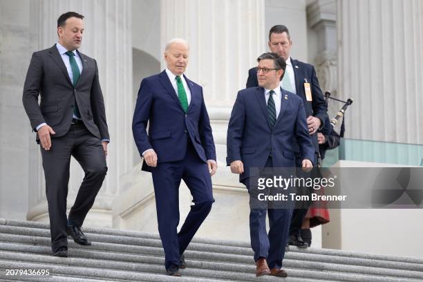 Irish Taoiseach Leo Varadkar, U.S. President Joe Biden and Speaker of the House Mike Johnson walk down the east steps of the House of Representatives...