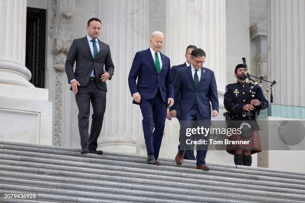 Irish Taoiseach Leo Varadkar, U.S. President Joe Biden and Speaker of the House Mike Johnson walk down the east steps of the House of Representatives...