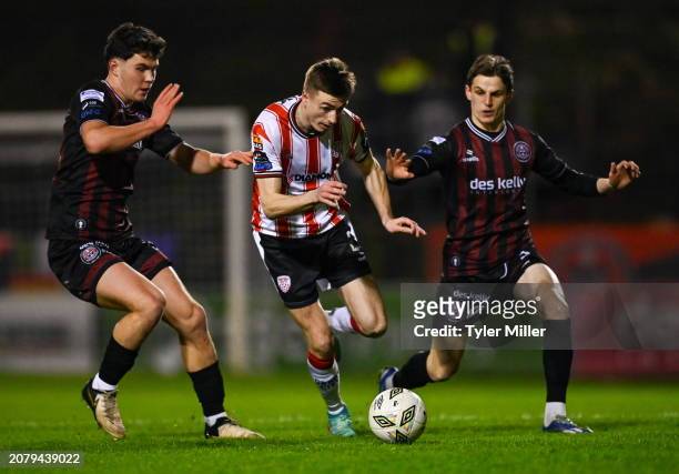 Dublin , Ireland - 15 March 2024; Daniel Kelly of Derry City in action against James Clarke, left, and Paddy Kirk of Bohemians during the SSE...