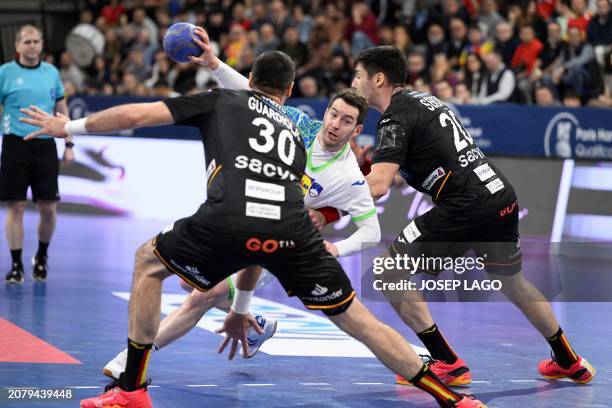 Slovenia's centre back Miha Zarabec vies with Spain's pivot Gedeon Guardiola Villaplana and Spain's pivot Abel Serdio Guntin during the qualifying...