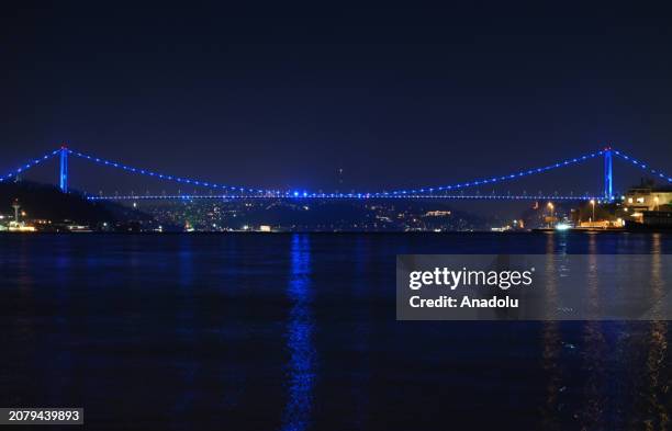 View of the Fatih Sultan Mehmet Bridge, illuminated with blue lights to raise awareness for colon cancer in Istanbul, Turkiye on March 15, 2024.