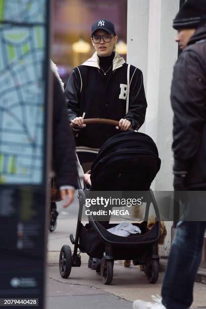 Roxy Horner is seen taking a stroll with her baby daughter on March 12, 2024 in London, United Kingdom.